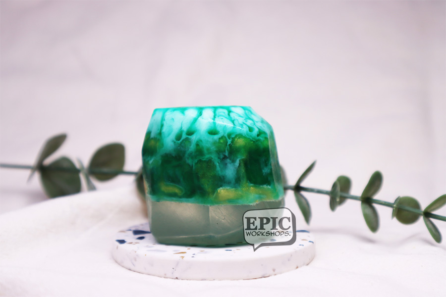 Participant mixing colour for gemstone soap